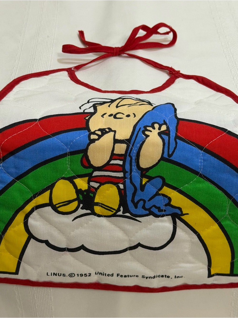 Peanuts Kids Bib with Linus Rainbow Design - Red, Blue, Green, Yellow